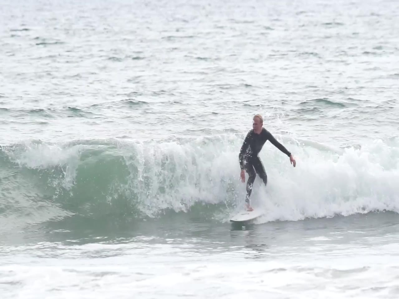 Jay Reyner surfing
